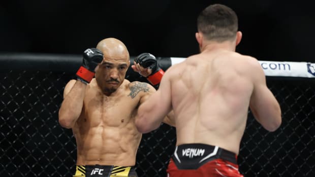 Aug 20, 2022; Salt Lake City, Utah, USA; Jose Aldo (red gloves) fights Merab Dvalishvili (blue gloves) during UFC 278 at Vivint Arena. Mandatory Credit: Jeffrey Swinger-USA TODAY Sports